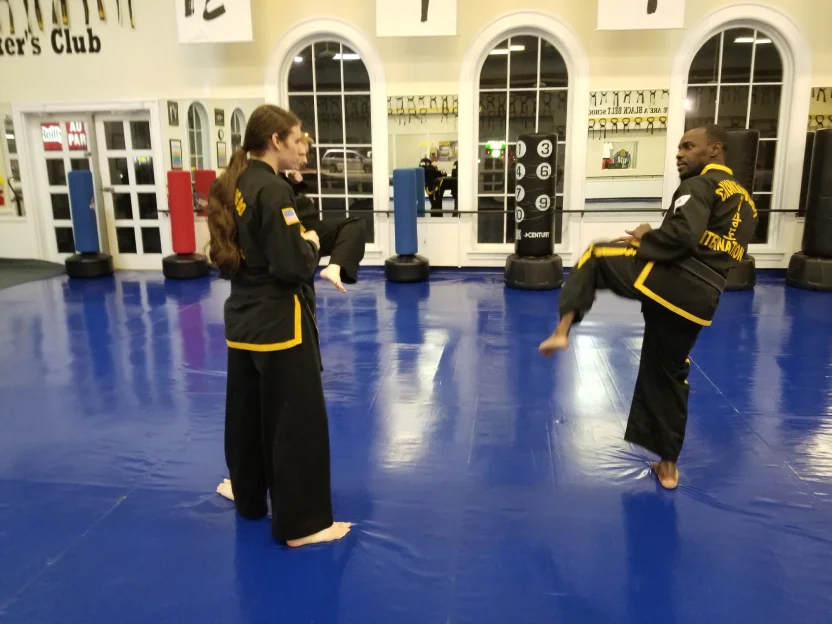 Adult Martial Arts students practicing self-defense techniques in High Springs dojo